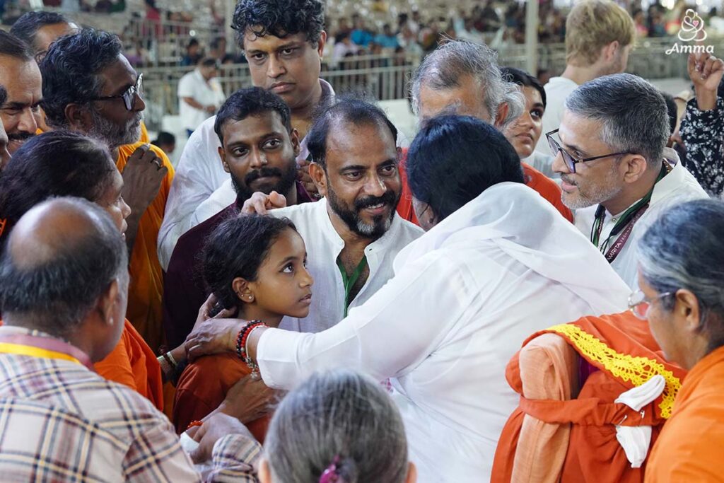 people come to Amma for an embrace, her darshan