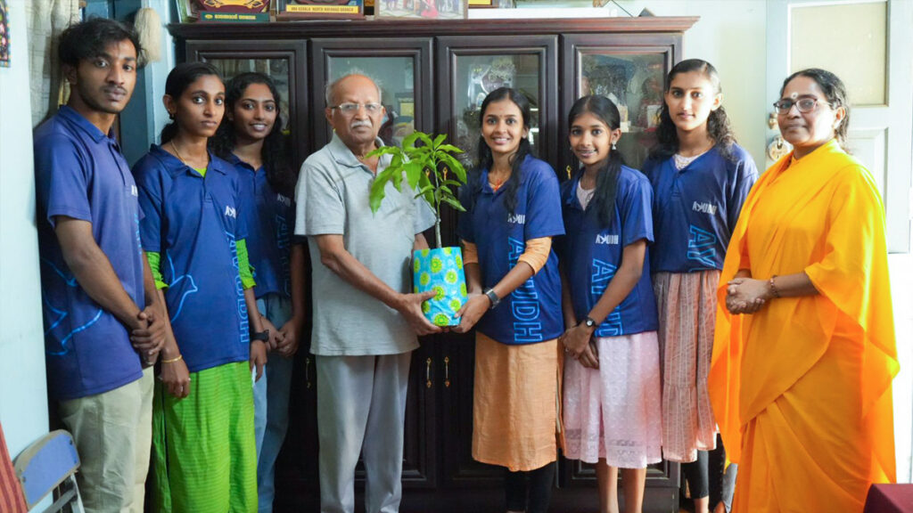 AYUDH members hold saplings