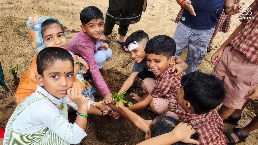 children planting a sapling